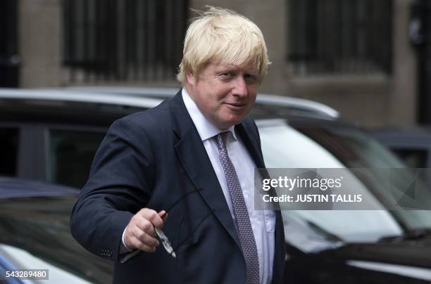 Former London mayor and Brexit campaigner Boris Johnson walks through buildings inside the Houses of Parliament and Portcullis House in central...