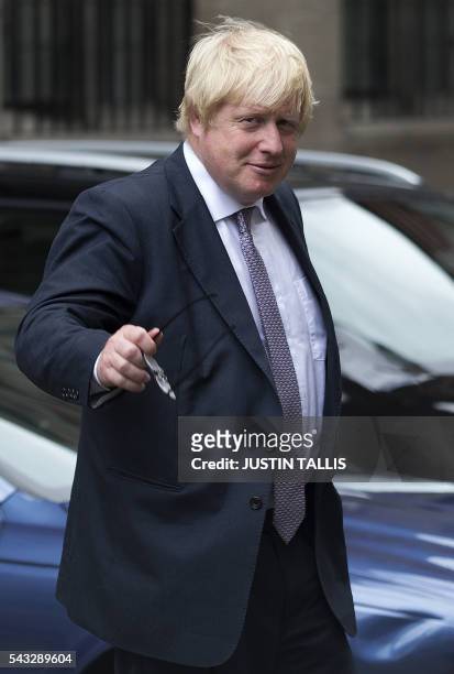 Former London mayor and Brexit campaigner Boris Johnson walks through buildings inside the Houses of Parliament and Portcullis House in central...