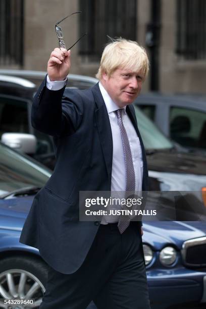 Former London mayor and Brexit campaigner Boris Johnson walks through buildings inside the Houses of Parliament and Portcullis House in central...