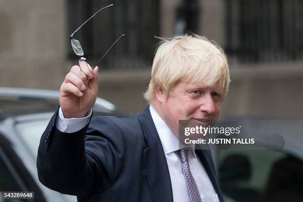 Former London mayor and Brexit campaigner Boris Johnson walks through buildings inside the Houses of Parliament and Portcullis House in central...