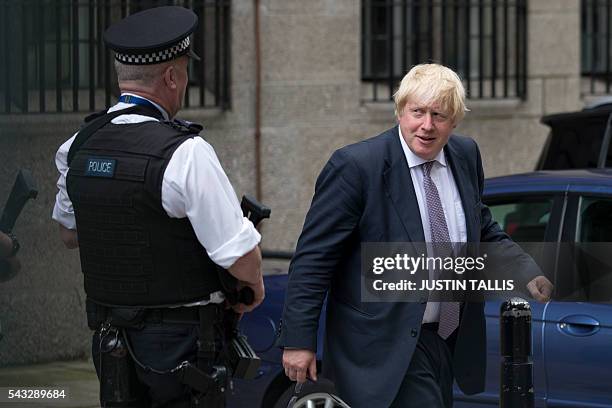 Former London mayor and Brexit campaigner Boris Johnson walks through buildings inside the Houses of Parliament and Portcullis House in central...