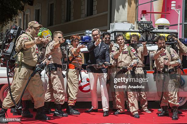 Director Paul Feig poses with walk-on ghostbusters during "GHOSTBUSTERS" photocall at the House of Cinema Villa Borghese on June 27, 2016 in Rome,...