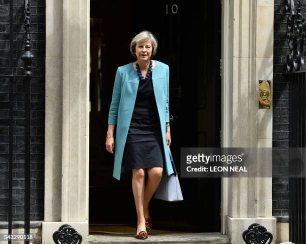 British Home Secretary Theresa May walks through the door of 10 Downing Street after attending a cabinet meeting in central London on June 27, 2016....