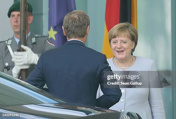 German Chancellor Angela Merkel greets European Council President Donald Tusk upon his arrival four days after the Brexit vote was confirmed in the...