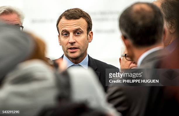 French Economy and Industry minister Emmanuel Macron speaks as he visits Aperam's stainless facilities in Isbergues, northern France, on June 27,...