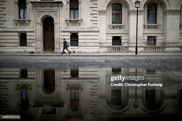 Man walks past government buildings in Whitehall as David Cameron holds his first cabinet meeting since Brexit on June 27, 2016 in London, England....