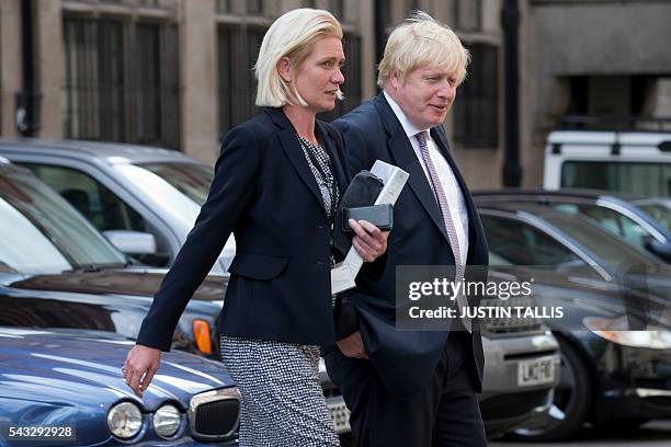 Conservative party politician Amanda Milling and former London mayor and Brexit campaigner Boris Johnson walk through buildings inside the Houses of...