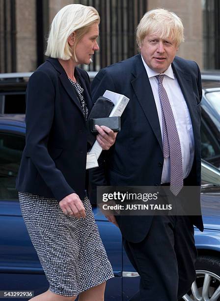 Conservative party politician Amanda Milling and former London mayor and Brexit campaigner Boris Johnson walk through buildings inside the Houses of...