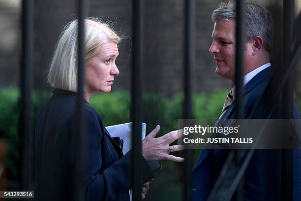 Conservative party politician Amanda Milling is pictured in conversation in a courtyard attached to the Portcullis House building in London on June...