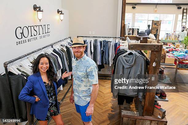 Got Style owner Melissa Austria dresses her husband Phil Campbell in a Reyn Spooner summer shirt at Got Style in the Distillery District, June 14,...