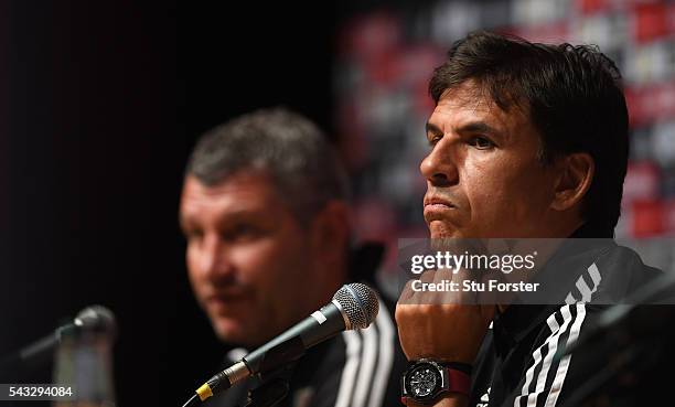 Wales manager Chris Coleman and assistant Osian Roberts face the media during a Wales press conference at their Dinard base camp ahead of their Euro...