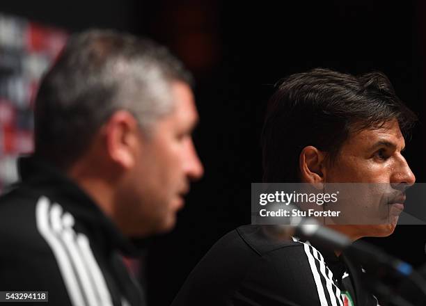 Wales manager Chris Coleman and assistant Osian Roberts face the media during a Wales press conference at their Dinard base camp ahead of their Euro...