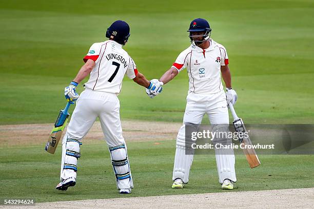 Alviro Petersen of Lancashire celebrates his century and a half with team mate Liam Livingstone during day two of the Specsavers County Championship...