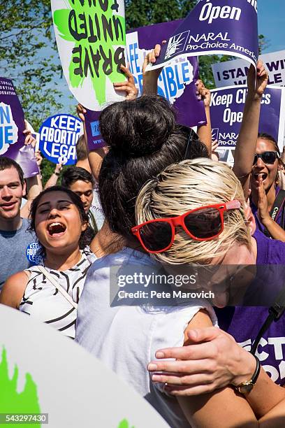 Abortion rights activists Morgan Hopkins of Boston, left, and Alison Turkos of New York City, celebrate on the steps of the United States Supreme...
