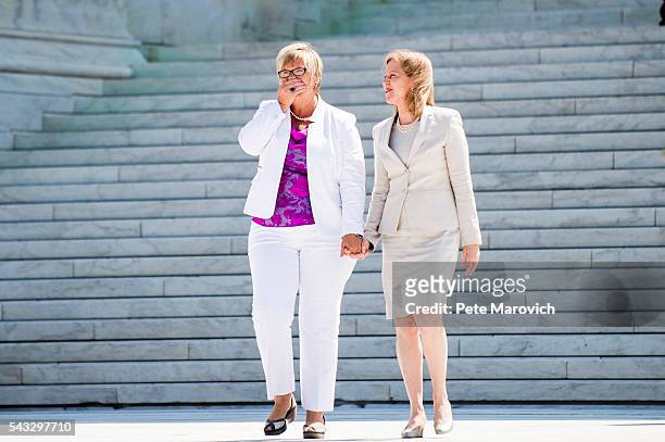 Texas abortion provider Amy Hagstrom-Miller is overcome from the applause as she walks down the steps of the United States Supreme Court with Nancy...