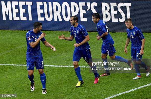 Italy's defender Giorgio Chiellini celebrates a goal with Italy's forward Pelle , Italy's forward Citadin Martins Eder and Italy's midfielder...
