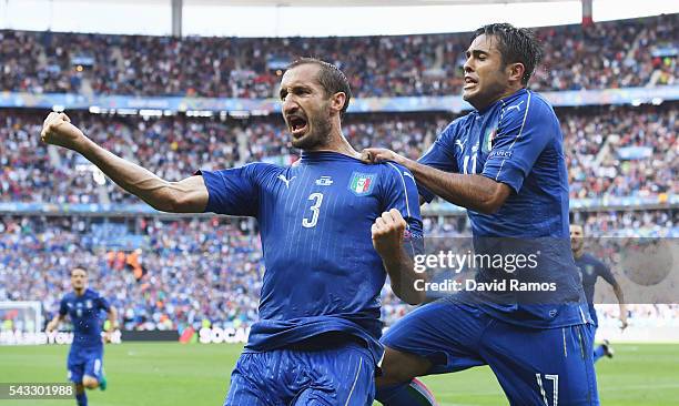 Giorgio Chiellini of Italy celebrates scoring with Eder after scoring the opening goal with his team mate Eder during the UEFA EURO 2016 round of 16...