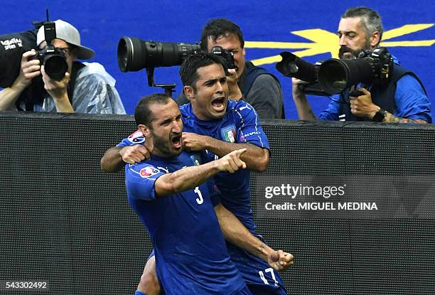 Italy's defender Giorgio Chiellini celebrates a goal with Italy's forward Citadin Martins Eder during the Euro 2016 round of 16 football match...