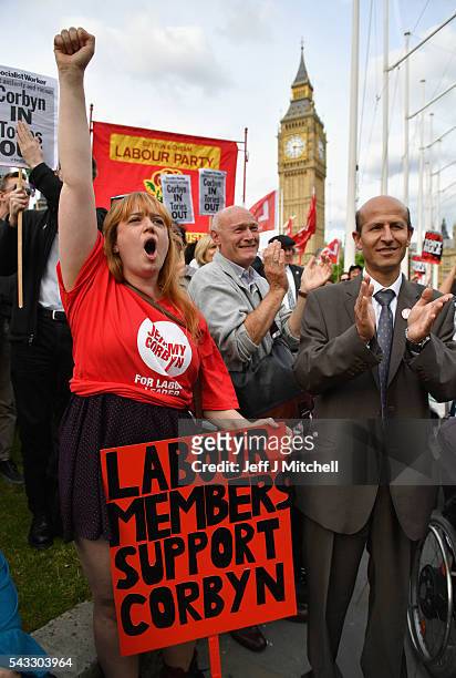 Supporters of Labour leader Jeremy Corbyn shout and clap during Momentum's 'Keep Corbyn' rally outside the Houses of Parliament on June 27, 2016 in...