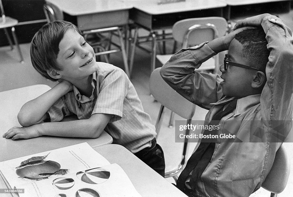 Jim Hard of Framingham, and Joseph Reis of Roxbury, get acquainted on
