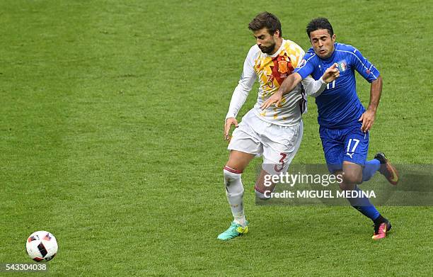 Spain's defender Gerard Pique vies with Italy's forward Citadin Martins Eder during Euro 2016 round of 16 football match between Italy and Spain at...