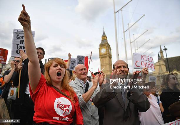 Supporters of Labour leader Jeremy Corbyn shout and clap during Momentum's 'Keep Corbyn' rally outside the Houses of Parliament on June 27, 2016 in...