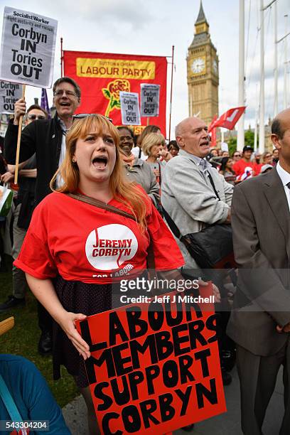 Supporters of Labour leader Jeremy Corbyn shout during Momentum's 'Keep Corbyn' rally outside the Houses of Parliament on June 27, 2016 in London,...