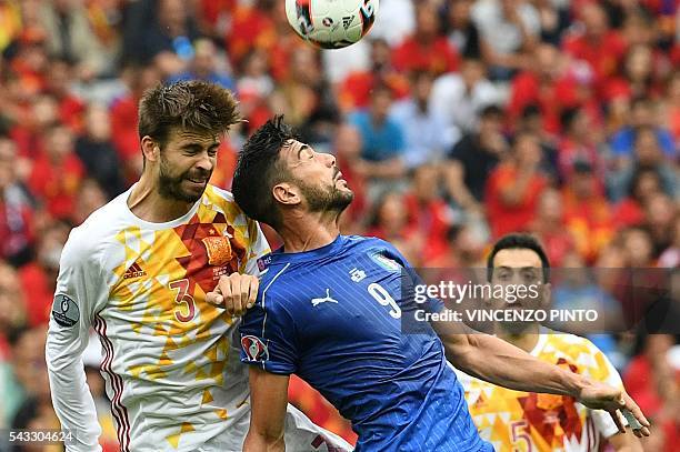 Spain's defender Gerard Pique vies for the ball with Italy's forward Pelle during the Euro 2016 round of 16 football match between Italy and Spain at...