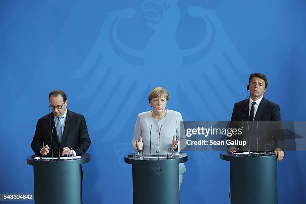 German Chancellor Angela Merkel, French President Francois Hollande and Italian Prime Minister Matteo Renzi speak to the media during talks at the...