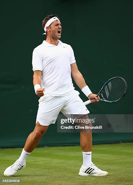 Marcus Willis of Great Britain celebrates winning the first set during the Men's Singles first round match against Ricardas Berankis of Lithuania on...