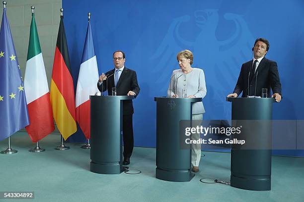 German Chancellor Angela Merkel, French President Francois Hollande and Italian Prime Minister Matteo Renzi speak to the media during talks at the...