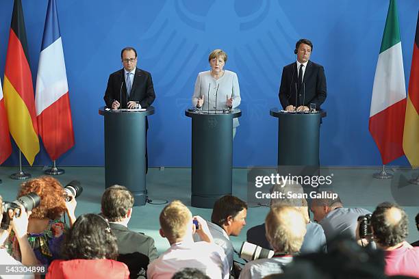 German Chancellor Angela Merkel, French President Francois Hollande and Italian Prime Minister Matteo Renzi speak to the media during talks at the...