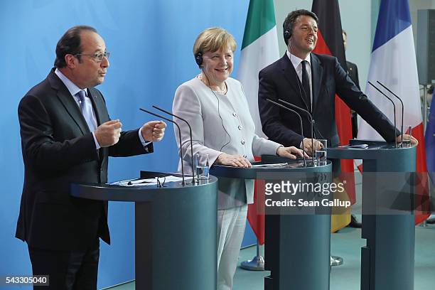 German Chancellor Angela Merkel, French President Francois Hollande and Italian Prime Minister Matteo Renzi speak to the media during talks at the...