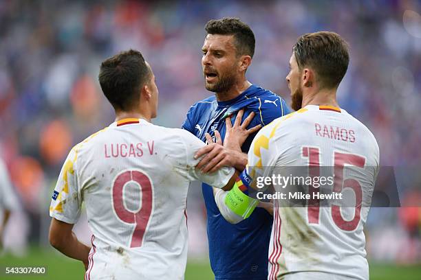 Graziano Pelle of Italy argues with Lucas Vazquez and Sergio Ramos of Spain during the UEFA EURO 2016 round of 16 match between Italy and Spain at...