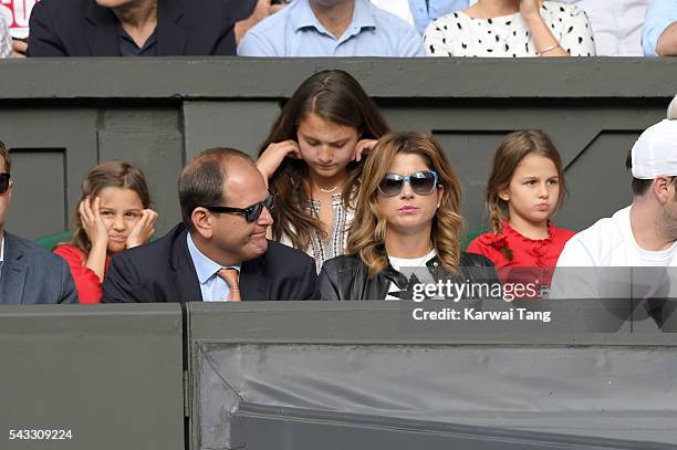 Mirka Federer and twin daughters Myla Rose Federer and Charlene Riva Federer attend day one of the Wimbledon Tennis Championships at Wimbledon on...