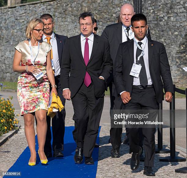 President Mario Draghi arrives accompanied of ECB Director General Communications Christine Graeff and flanked by security guards to participate in...