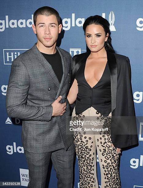 Singers Nick Jonas and Demi Lovato arrive at the 27th Annual GLAAD Media Awards at The Beverly Hilton Hotel on April 2, 2016 in Beverly Hills,...