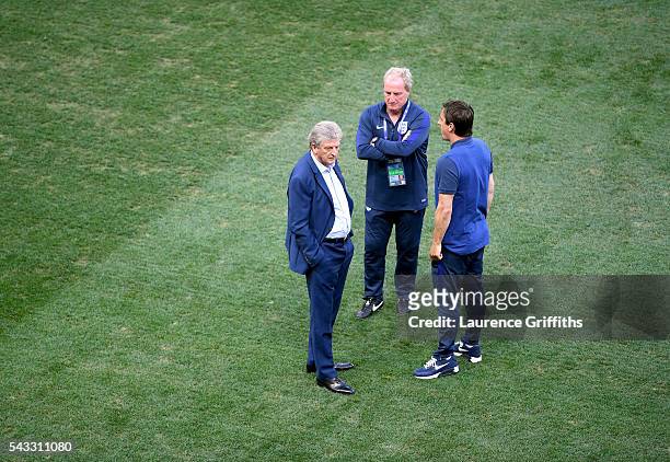 England manager Roy Hodgson speaks with his assistant coaches Ray Lewington and Gary Neville prior to kickoff during the UEFA EURO 2016 round of 16...