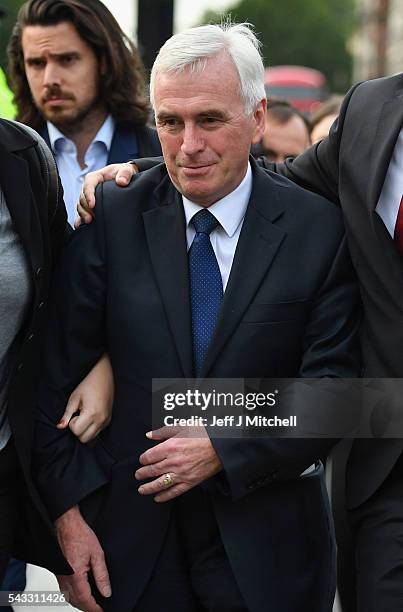 Shadow Chancellor of the Exchequer John McDonnell arrives to deliver a speech during Momentum's 'Keep Corbyn' rally outside the Houses of Parliament...