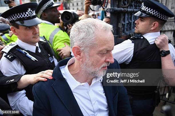 Labour leader Jeremy Corbyn makes his way through the crowd during Momentum's 'Keep Corbyn' rally outside the Houses of Parliament on June 27, 2016...