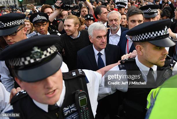 Labour Leader Jeremy Corbyn makes his way through the crowd with Shadow Chancellor of the Exchequer John McDonnell during Momentum's 'Keep Corbyn'...