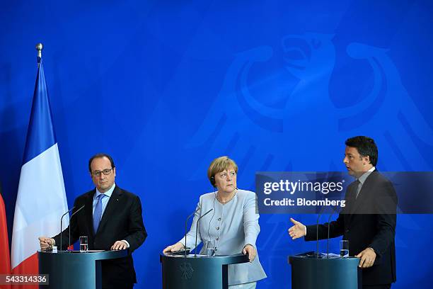 Matteo Renzi, Italy's prime minister, right, speaks as Angela Merkel, Germany's chancellor, center, and Francois Hollande, France's president, listen...