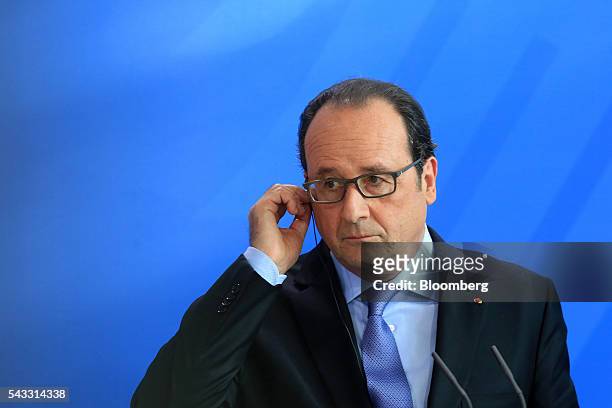 Francois Hollande, France's president, listens during a news conference at the Chancellery in Berlin, Germany, on Monday, June 27, 2016. Angela...