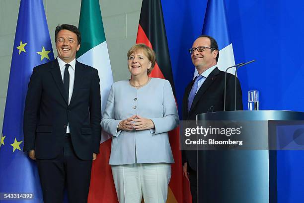 Francois Hollande, France's president, from left, Angela Merkel, Germany's chancellor, and Matteo Renzi, Italy's prime minister, stand for a...