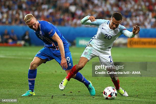 Kolbeinn Sigthorsson of Icelend competes with Dele Alli of England during the UEFA Euro 2016 Round of 16 match between England and Iceland at Allianz...