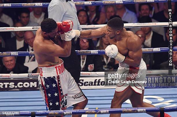 Anthony Joshua throws a right hand punch on Dominic Breazeale during their bout for the IBF World Heavyweight Title at The O2 Arena on June 25, 2016...