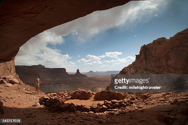 woman hiker stormy alcove overlook canyonlands national park utah - puebloan peoples stock pictures, royalty-free photos & images