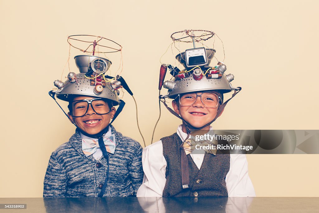 Two Boys Dressed as Nerds Smiling with Mind Reading Helmets