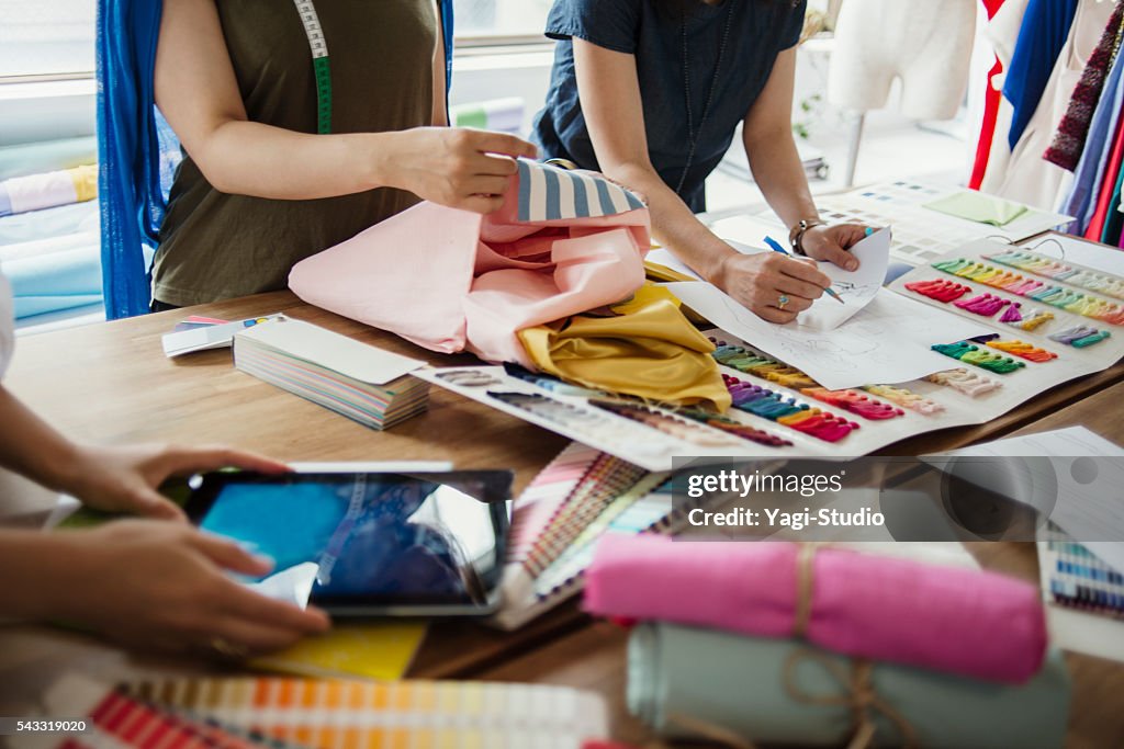 Fashion designers working in studio