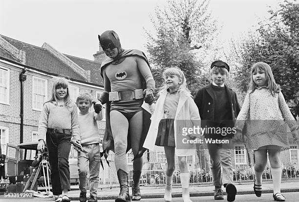 American actor Adam West dressed as 'Batman' for the filming of a road safety advert for children, 7th May 1967.